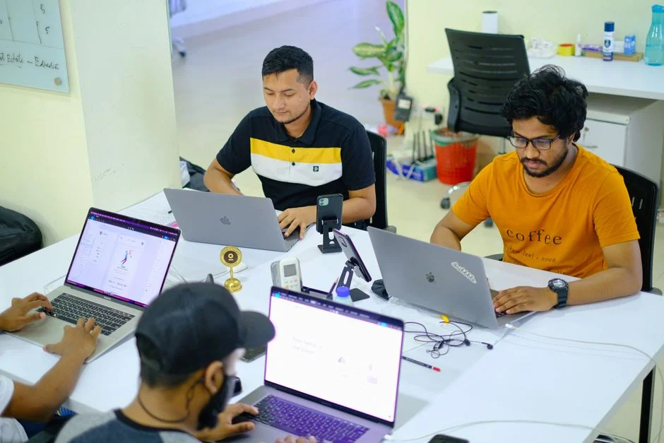services-01 A clean and modern workspace featuring a laptop, tablet, smartphone, and monitor. Ideal for remote work and tech setups.